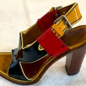 Prada women’s sandals/heels.  Black, red, yellow with brown heels.  size 6 1/2.